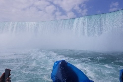 the maid of the mist heading into the base of Niagara Falls